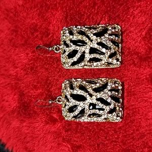 None earrings black faux stone encased with gold tone metal sparkles costume